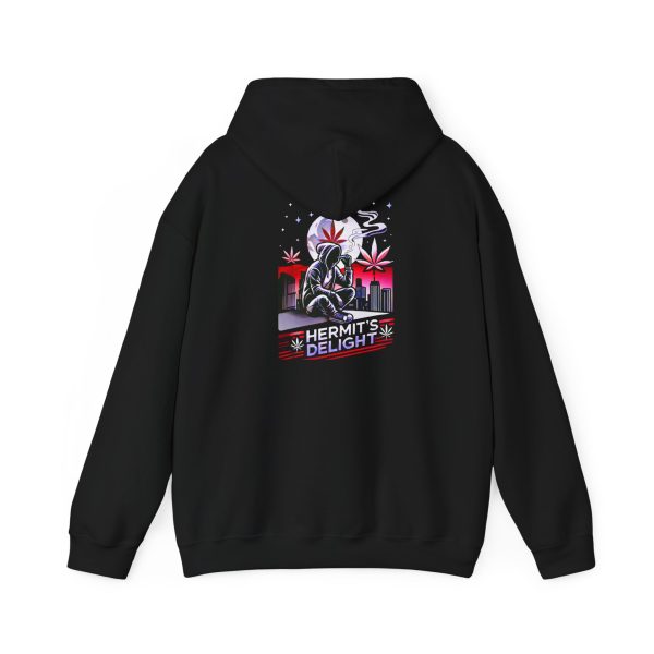 unisex heavy blend™ hooded sweatshirt, back view with the hood lowered, graphic t-shirt design featuring a hooded figure smoking in front of a cityscape at night, with a large moon, red cannabis leaves, and the text 'Hermit's Delight' in bold lettering. Urban, moody style with red, purple, and black tones. Only the top of the moon is covered by the hood.