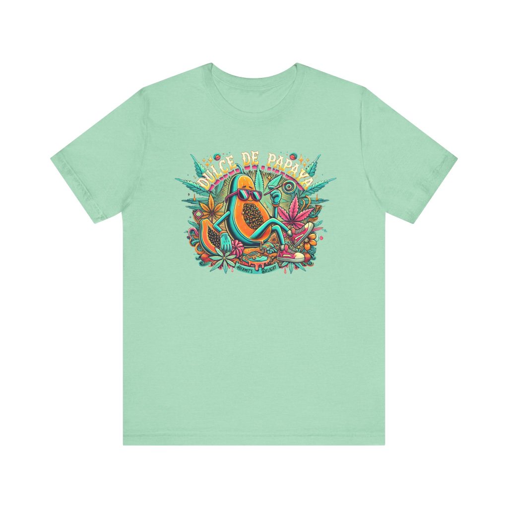 mint t-shirt with a colorful graphic of a lounging papaya character wearing sunglasses, surrounded by marijuana leaves and the words “Dulce de Papaya” in bold text above.