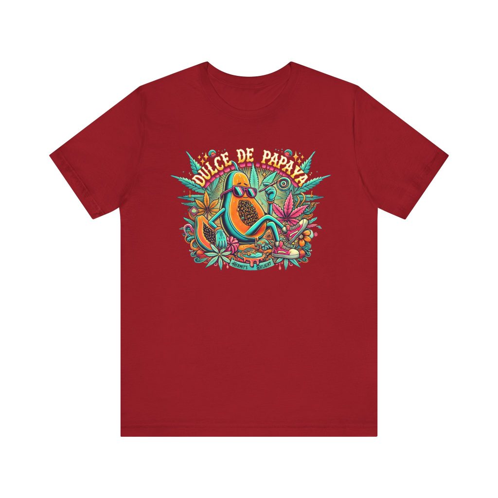 Red t-shirt with a colorful graphic of a lounging papaya character wearing sunglasses, surrounded by marijuana leaves and the words “Dulce de Papaya” in bold text above.