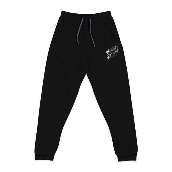 black sweatpants, hermit's delight logo embroidered on top of left leg