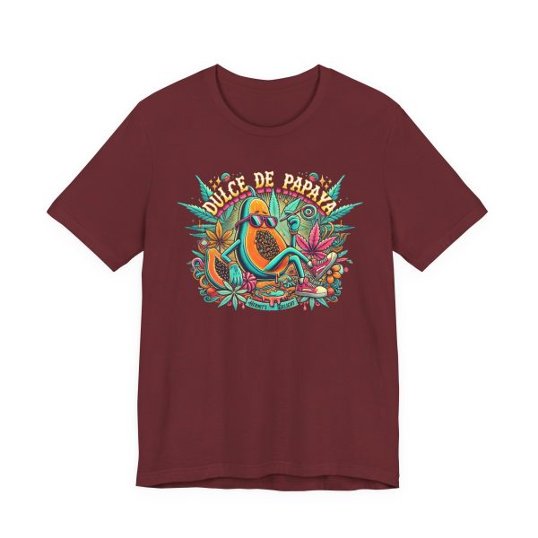 deep red t-shirt with a colorful graphic of a lounging papaya character wearing sunglasses, surrounded by marijuana leaves and the words “Dulce de Papaya” in bold text above.